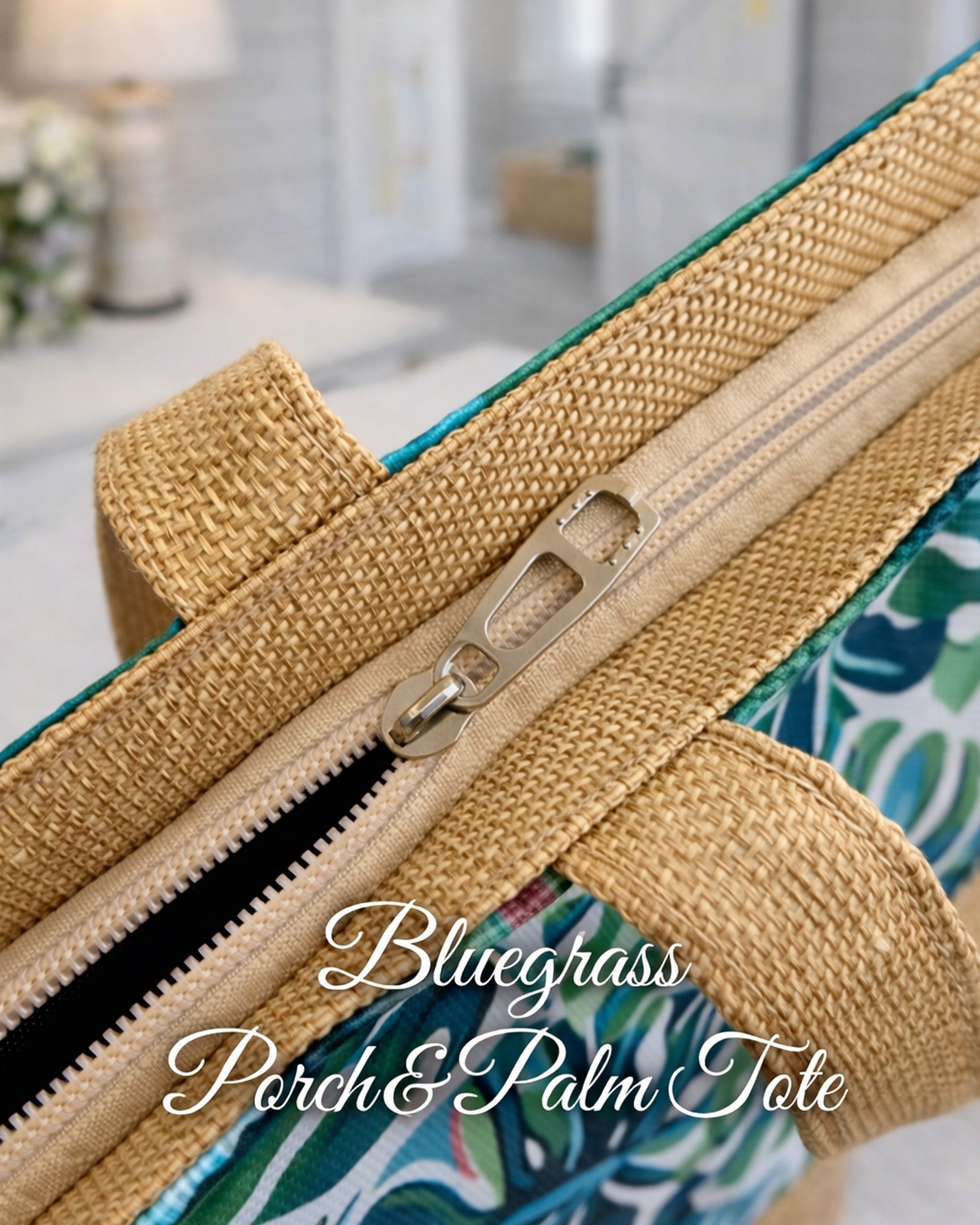 Close-up of Bluegrass Porch & Palm Tote Bag zip-top closure and woven-look strap detail