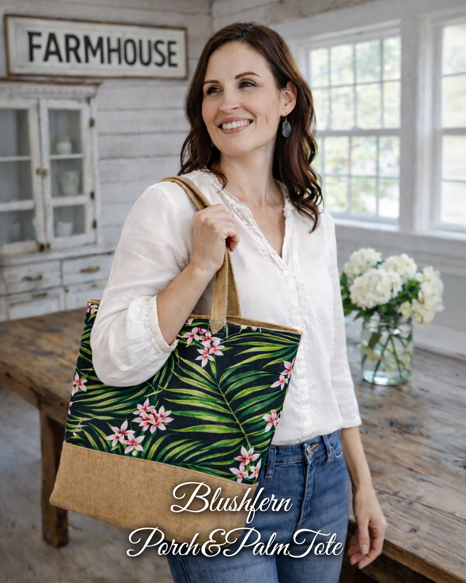 Woman carrying Blushfern Porch & Palm Tote Bag with tropical floral print in a farmhouse room